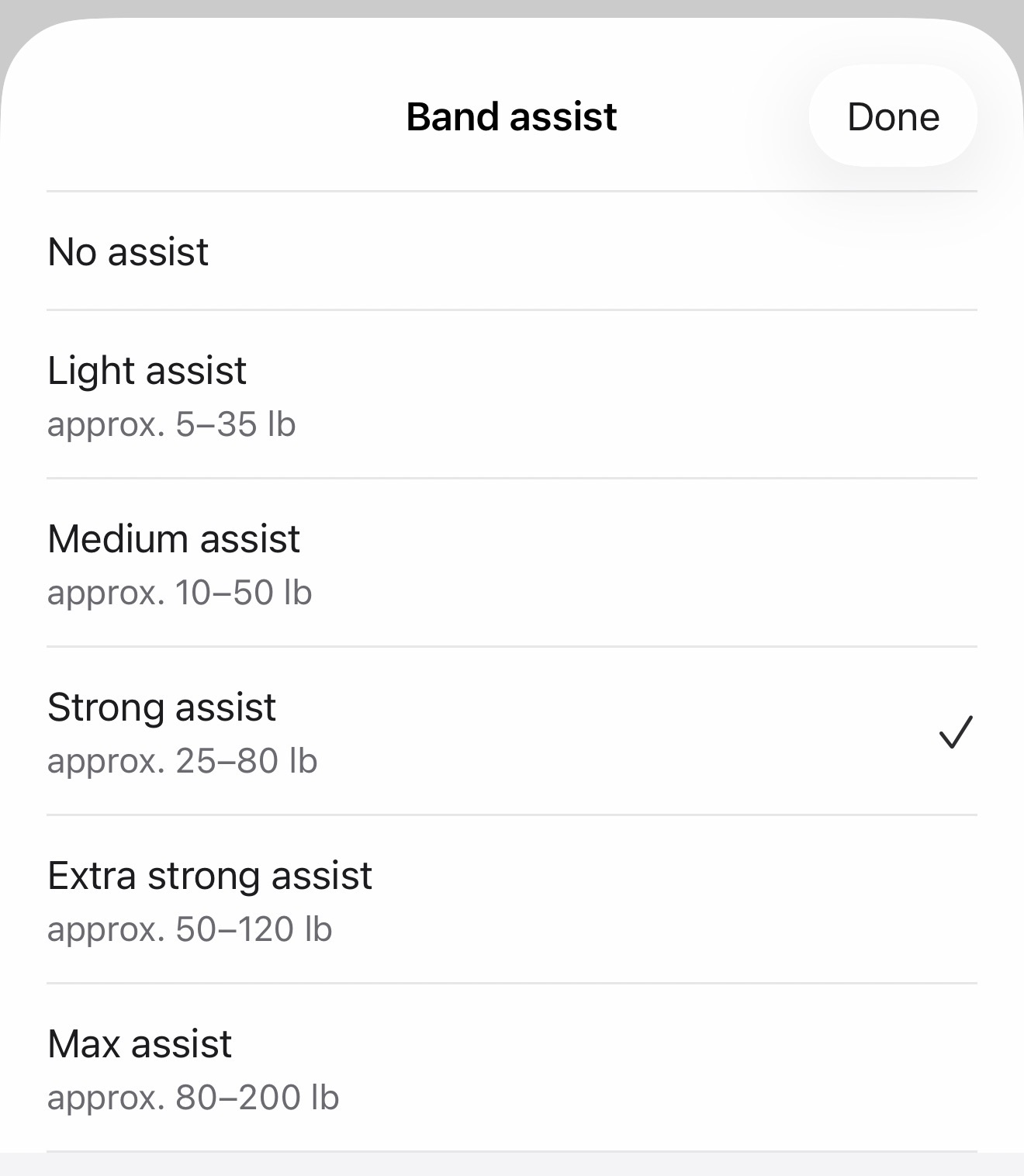 Fitness Karma Band assist selection sheet showing No assist, Light assist, Medium assist, Strong assist, Extra strong assist, and Max assist, with approximate ranges and Strong assist selected.